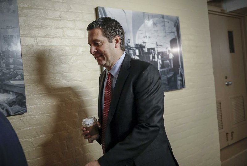 House Intelligence Committee Chairman Devin Nunes heads to a GOP conference Tuesday at the Capitol.  
