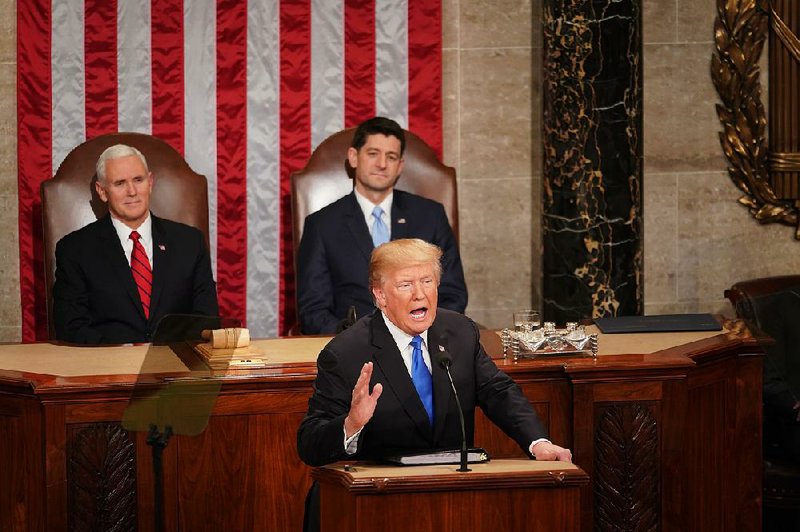 Vice President Mike Pence (left) and House Speaker Paul Ryan sit behind President Donald Trump as he lists his achievements and details his legislative proposals for Congress. 