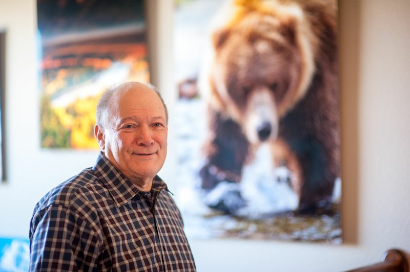 NWA Democrat-Gazette/Lara Jo Hightower Bill Petrunich's photography work sometimes puts him in the path of dangerous animals -- like this brown bear he photographed in Alaska.