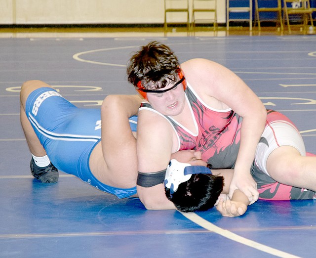 RICK PECK/SPECIAL TO MCDONALD COUNTY PRESS McDonald County's Lane Pointer nearly has Carthage's Brener Ocana pinned in their 285-pound match at a dual on Jan. 25 at Carthage High School. Ocana was able to stave off the near pin and came back to pin Pointer in the final minute of the match.