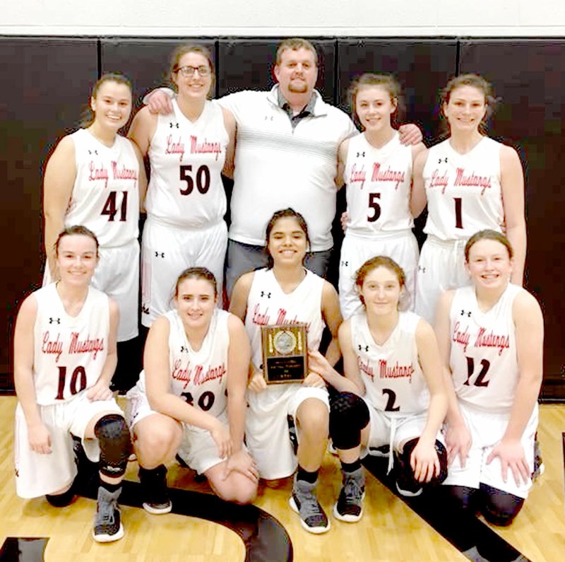 Photo Submitted The McDonald County High School junior varsity girls' basketball team defeated Cassville and Neosho to win the Cassville Junior Varsity Girls' Basketball Tournament on Jan. 27 at Cassville High School. Pictured with their championship plaque were Lily Allman (front, left), Laney Wilson, Alexia Estrada, Addy Mick, Katie Kester, Jaylie Sanny (back, left), Mollie Milleson, Coach Jonathan Vire, Sydney Killion and Caitlyn Barton.