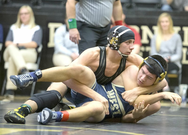 File Photo/NWA Democrat-Gazette Bentonville High's Cash Jones (top) is 55-1 on the season, and Tigers coach James Wrapp said the senior can compete anywhere between the 160- and 195-pound divisions at the Arkansas Wrestling Coaches/Officials Association Dual State Tournament.