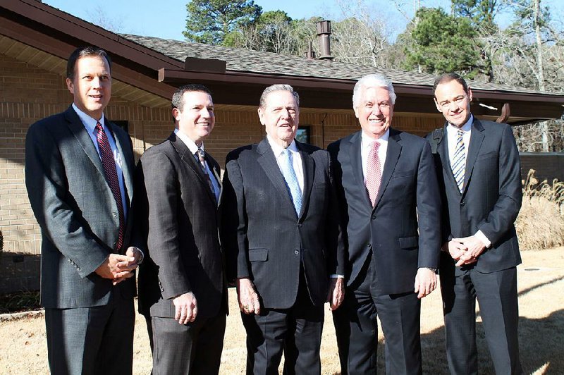 General Authority Seventy Jorg Klebingat (left), Little Rock Stake President Jared Dixon of Benton, Quorum of the Twelve Apostles members Jeffrey Holland and Dieter Uchtdorf; and Area Seventy Michael Beheshti of Little Rock — all of the Church of Jesus Christ of Latter-day Saints — pause before the Sunday service in Little Rock on Jan. 27 in which Holland and Uchtdorf addressed the 51 congregations that comprise the church’s Arkansas Little Rock Coordinating Council. 