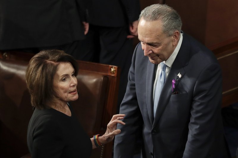 House Minority Leader Nancy Pelosi of California talks with Senate Minority Chuck Schumer of New York before the State of the Union address to a joint session of Congress on Capitol Hill in Washington, Tuesday, Jan. 30, 2018. (AP Photo/J. Scott Applewhite)