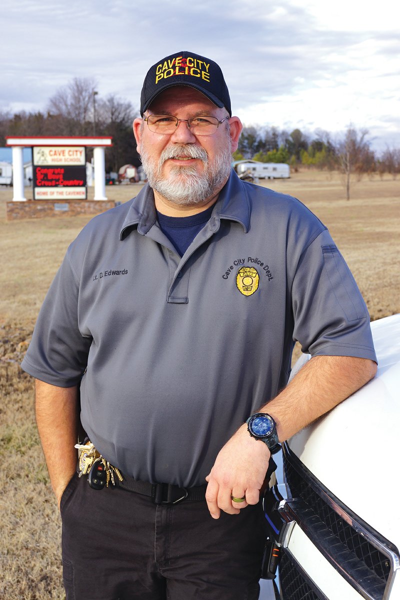 Lt. David Edwards of the Cave City Police Department stands in front of the school where he became a full-time resource officer last month after working part time since 2012. Edwards, 49, said he became interested in working for the school district after the mass shooting at Sandy Hook Elementary School in Connecticut.