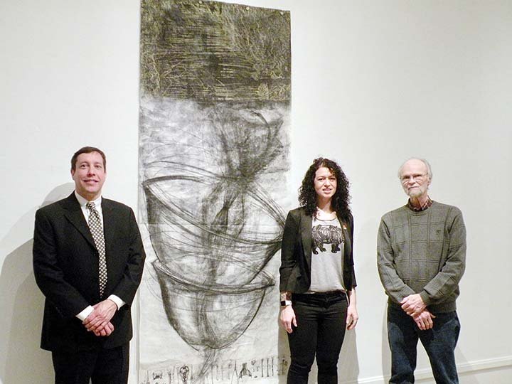 Pathways: An Exhibition of Large Format and Experimental Printmaking opened Jan. 25 at Baum Gallery at the University of Central Arkansas. Attending the opening reception are, from left, Brian Young, Baum Gallery director; Jessie Hornbrook, UCA art instructor with her work Murmuration Unraveled; and Roger Bowman, retired UCA art professor, who has three pieces of his work in the show.