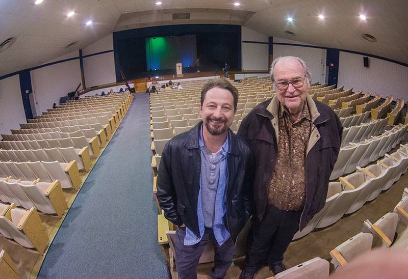 Jeremy Clay, left, and Bob Padgett reflect on the history of Love Auditorium at Bryant High School. Clay, the school’s drama teacher, will direct the last performance in the auditorium before it is torn down to make room for a new fine arts center and other buildings. Padgett was a member of the Bryant School District when the auditorium was built in 1984.