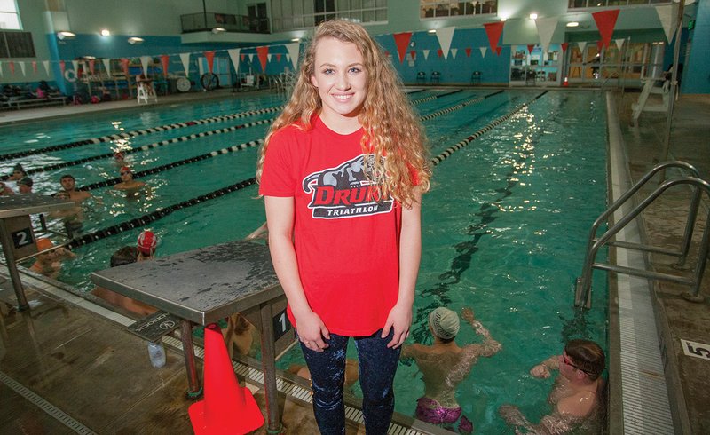 Cabot High School swimmer Melanie Abbott, standing next to the pool at the Veterans Park Community Center in Cabot, recently signed with Drury University in Springfield, Mo., to participate in the triathlon, which consists of swimming, cycling and running.