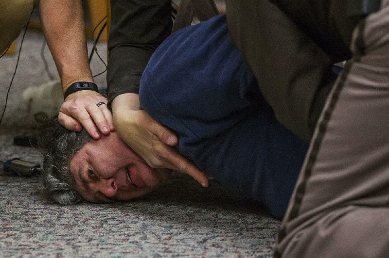 Deputies restrain Randall Margraves after Margraves, the father of three daughters abused by exsports doctor Larry Nassar, lunged at Nassar in a Charlotte, Mich., courtroom on Friday. story.lead_photo.caption