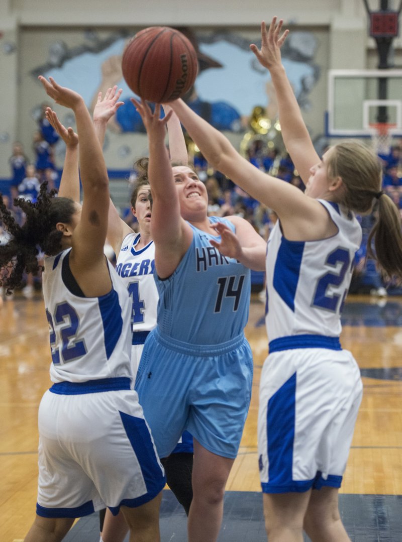 Maci Mains (14) of Springdale Har-Ber puts up a shot amid Rogers High defenders Amber Covington (22) and Kate McConnell (23) on Friday at King Arena in Rogers.