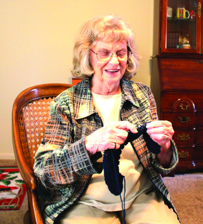 Knitting: Mary Jo Crosley knits a hat for Operation Gratitude, an organization that sends care packages to the military and their families.