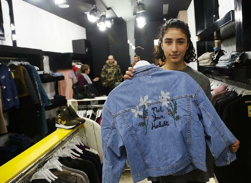 Palestinian-American Yasmeen Mjalli last month displays a jacket with the slogan “Not Your Habibti (Darling),” described as a retort for catcalls, in the West Bank city of Ramallah.