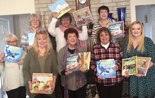 Courtesy photo Altrusa of Fayetteville members, along with other Altrusa Clubs in Northwest Arkansas, donated books to the new Arkansas Children's Hospital. Pictured are Chris Bell (from front), Sue Payton, Katie Hill, Judy Rownak and Jennifer McKeown; and Carolyn Rash (from back), Rosemary Rogers and Mary Mann.