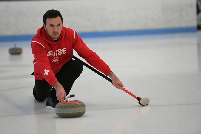 NWA Democrat-Gazette/J.T. WAMPLER Dominik Maerki of Fayetteville practices curling Thursday Jan. 25, 2018 at the Jones Center in Springdale. Maerki is a member of the Swiss curling team and will travel to the Winter Olympics in South Korea.