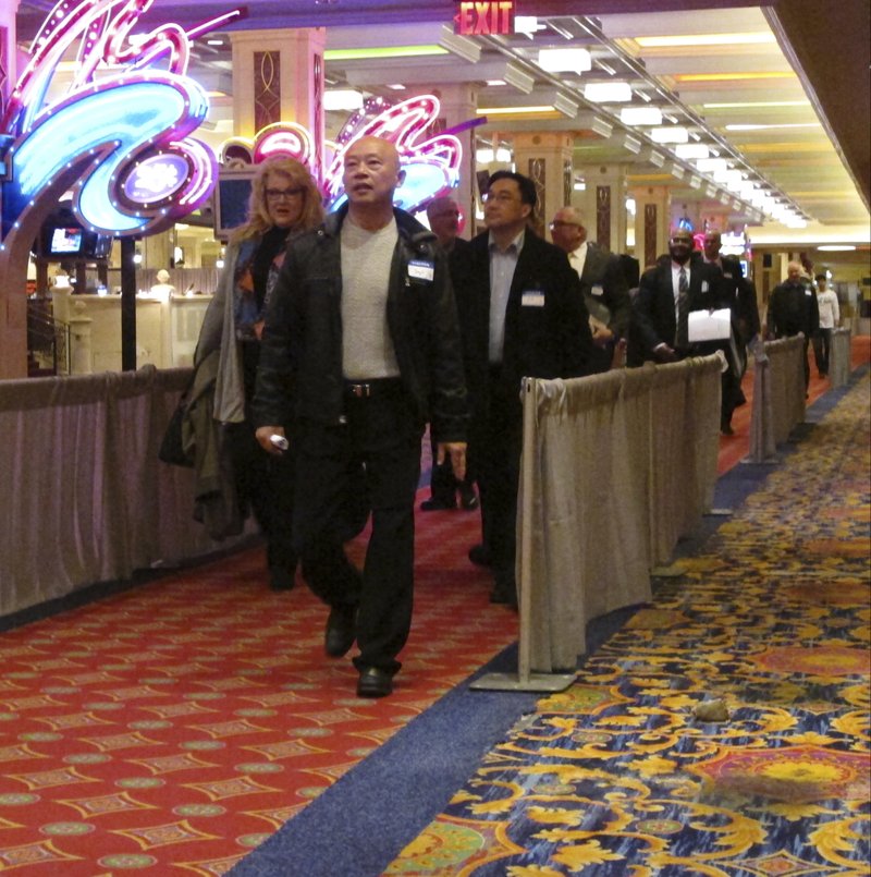 Applicants for jobs at the soon-to-open Hard Rock casino in Atlantic City N.J. line up for interviews on Tuesday, Jan. 30, 2018, at a hotel nearby. Tuesday's event was for former workers at the Trump Taj Mahal, which closed in 2016 but will reopen this summer as a Hard Rock casino resort. The former Revel casino is reopening around the same time as well as the Ocean Resort casino, adding thousands of jobs to a market that lost 11,000 since 2014 due to casino closings. (AP Photo/Wayne Parry)