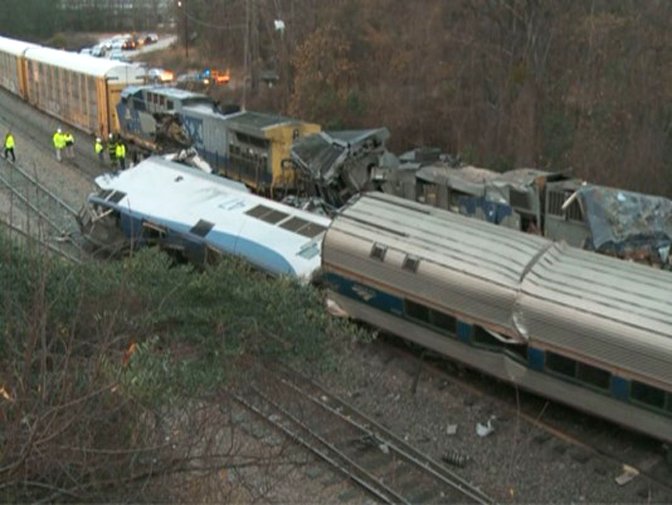 In this image from video, train cars are smashed and derailed Sunday, Feb. 4, 2018 near Cayce. S.C. The crash left multiple people dead and dozens of people injured. (WLTX TV via AP)

