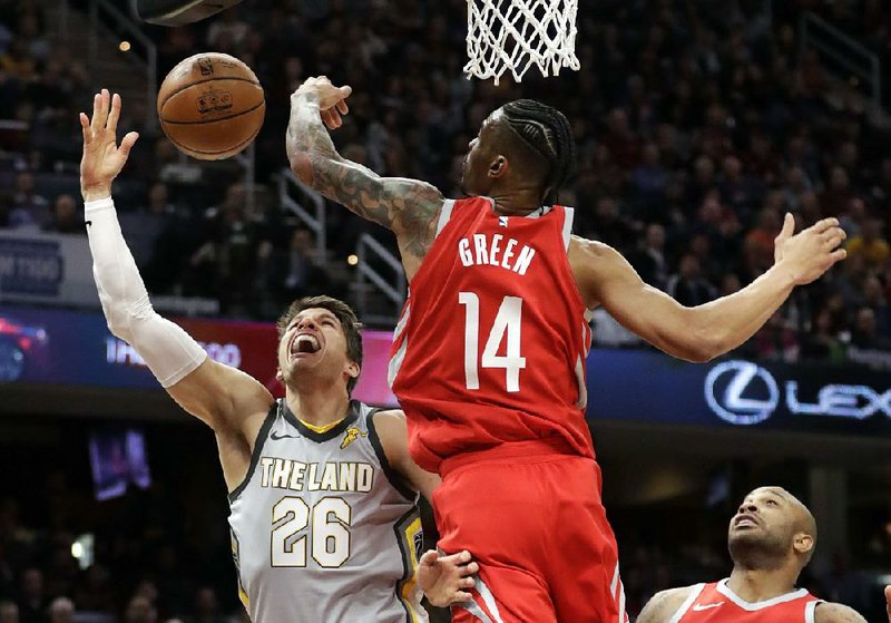 Kyle Korver (26) of the Cleveland Cavaliers loses control of the ball against Gerald Green (14) of the Houston
Rockets in the first half Saturday in Cleveland. The Cavaliers were routed 120-88 in another nationally televised
game in which they struggled.