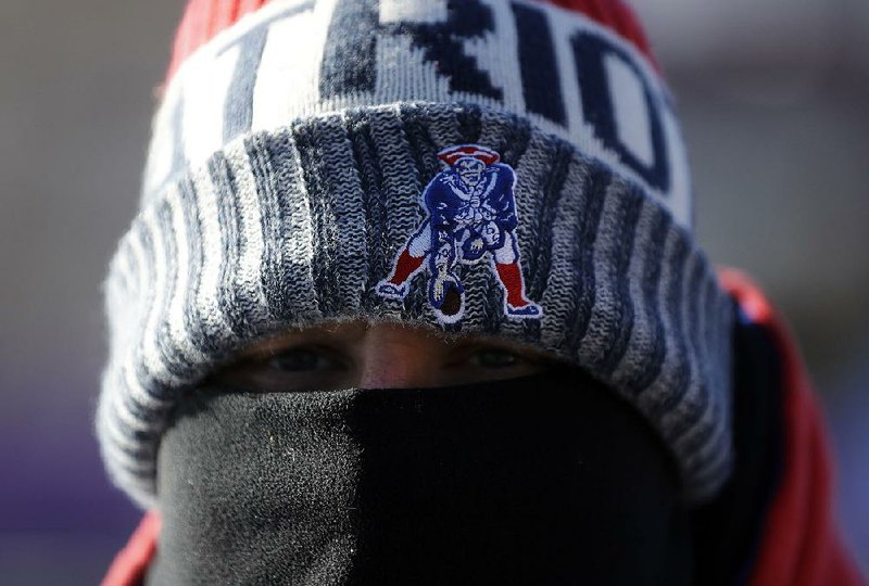 A New England fan makes his way to U.S. Bank Stadium for Super Bowl LII in Minneapolis on Sunday. The game time temperature outside the stadium was 2 degrees, making it the coldest game in Super Bowl history.