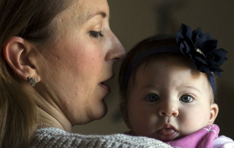 Finley Mala (right) was staying home with mom, Rebecca, during her first few months of life, but even so, when her older sister caught respiratory syncytial virus, she did, too.