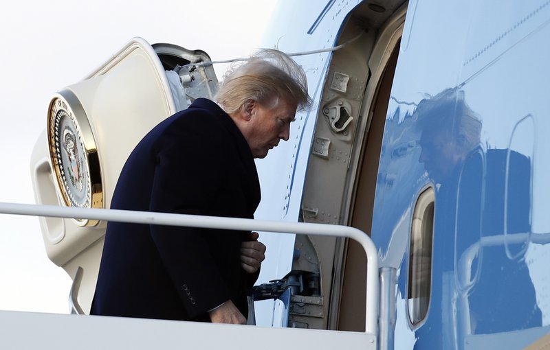 President Donald Trump boards Air Force One, Friday, Feb. 2, 2018, in Andrews Air Force Base, Md., en route to Palm Beach International Airport, in West Palm Beach, Fla. (AP Photo/Carolyn Kaster)
