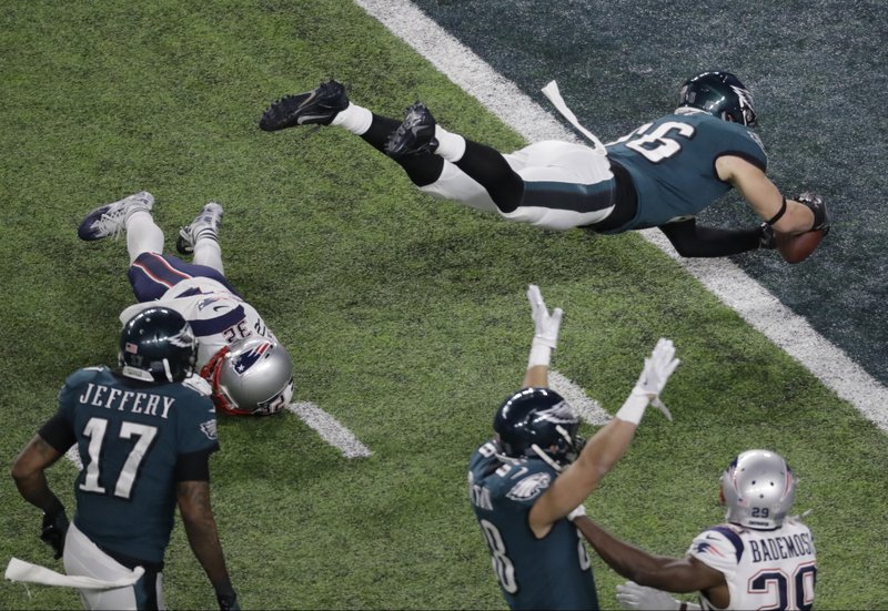 Philadelphia Eagles tight end Zach Ertz scores past New England Patriots free safety Devin McCourty during the second half of the NFL Super Bowl 52 football game Sunday, Feb. 4, 2018, in Minneapolis. (AP Photo/Eric Gay)