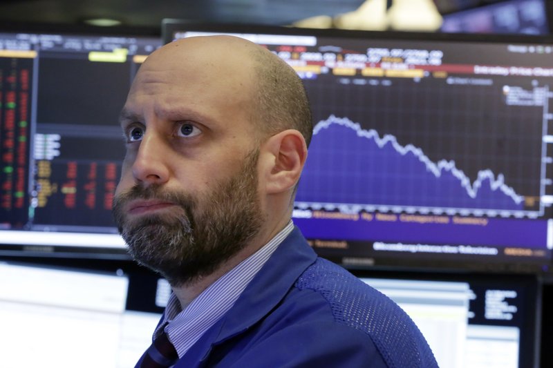 FILE - In this Feb. 2, 2018 file photo, specialist Meric Greenbaum works on the floor of the New York Stock Exchange. The stock market closed sharply lower, extending a weeklong slide, as the Dow Jones industrial average plunged more than 600 points. Some investors believe the market can recover, noting that both global economic growth and corporate earnings remain strong. One hallmark of this bull market has been investors’ willingness to buy the dips. This week’s drop could test their resolve. (AP Photo/Richard Drew)

