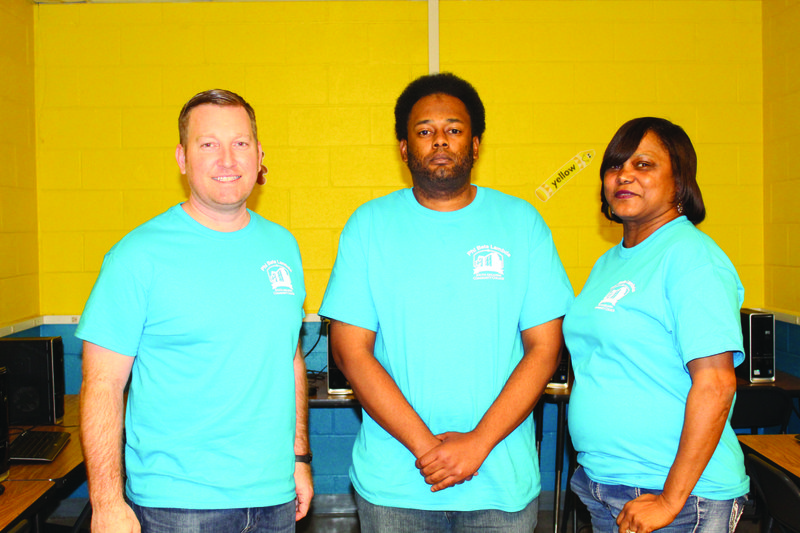 Captains: Project leaders, pictured from left, are Team IT captain William Clayton, project manager Christopher White and Team Paint captain Karen Cunningham. Brittany Williams/News-Times