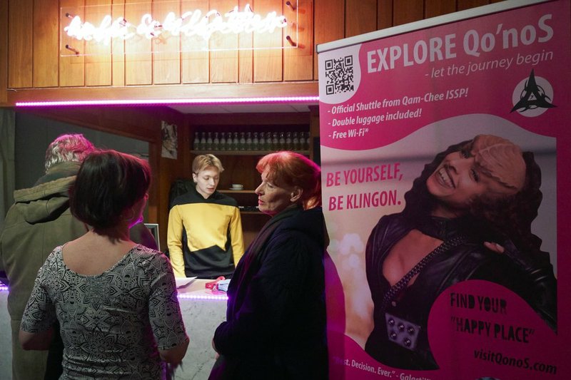 In this photo taken in Stockholm on Saturday, Feb. 3 2018, a man in a Star Fleet uniform distributes tickets to a presentation of Klingon culture. A theater in Stockholm is playing host to a Klingon delegation seeking to promote tourism to Qo'nos (pronounced "Kronos"), the home planet of the ruthless yet honorable race of warriors from the cult TV franchise "Star Trek." 