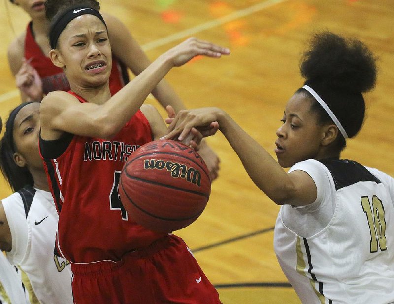 Little Rock Central’s Elyse Smith (right) blocks a shot by Fort Smith Northside’s Jersey Wolfenbarger during Northside’s 49-45 victory Tuesday night. Smith had 9 points for Central, while Wolfenbarger scored 5 for Northside. 