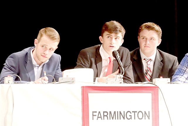 LYNN KUTTER ENTERPRISE-LEADER Coleman Warren, captain of Farmington's ACE team, answers one of the questions in the match Thursday at the Performing Arts Center in Farmington. Farmington won its match with 56 points.