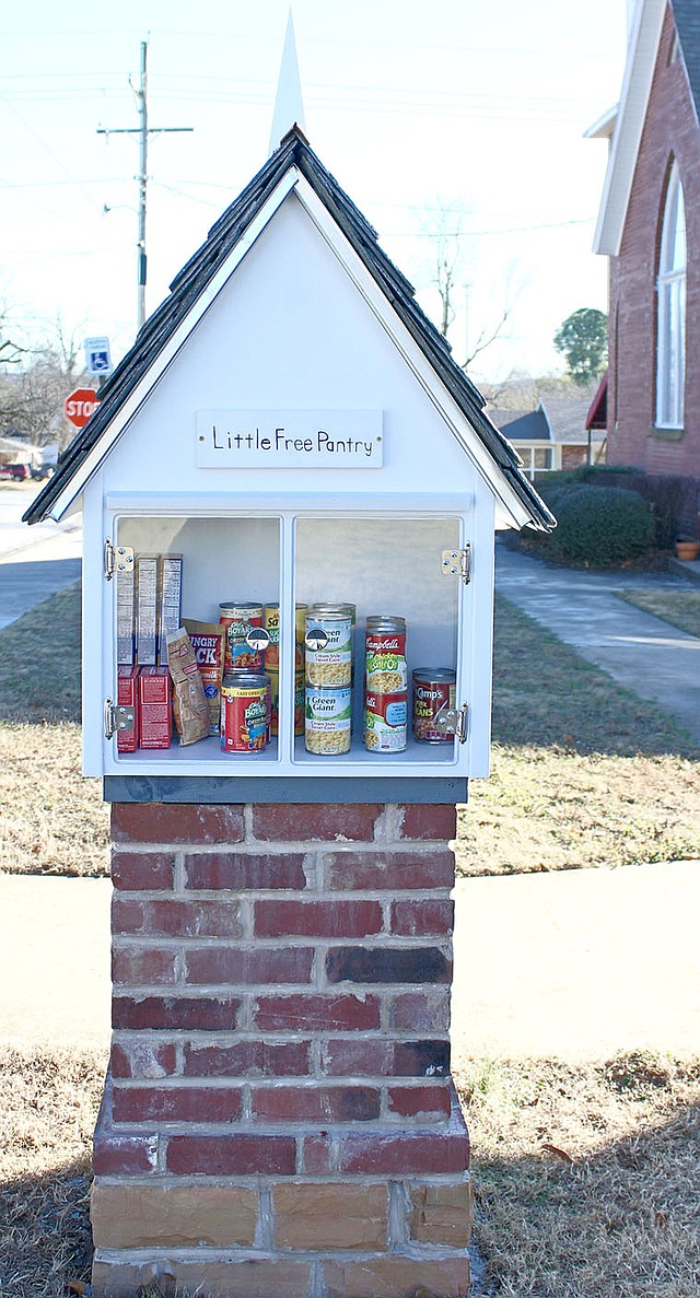COURTESY PHOTO This side has the Little Free Pantry that provides non-perishable food items for those who need it.