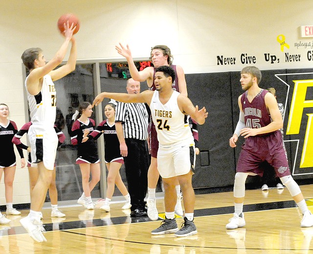 MARK HUMPHREY ENTERPRISE-LEADER Prairie Grove junior Will Pridmore utilizes a screen by teammate Demarkus Cooper to launch an open 3-pointer from the left corner. Prairie Grove defeated Lincoln, 64-36, Friday.