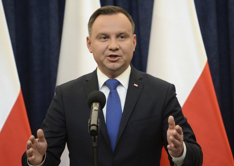 Polish President Andrzej Duda announces his decision to sign a legislation penalizing certain statements about the Holocaust, in Warsaw, Poland, Tuesday, Feb. 6, 2018. Duda said that he will also ask the constitutional court to make final ruling on the disputed Holocaust speech bill. (AP Photo/Alik Keplicz)