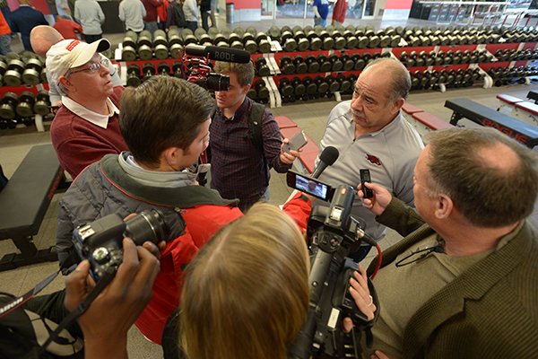 Arkansas defensive coordinator John Chavis is interviewed by reporters Wednesday, Feb. 7, 2018, in Fayetteville. 
