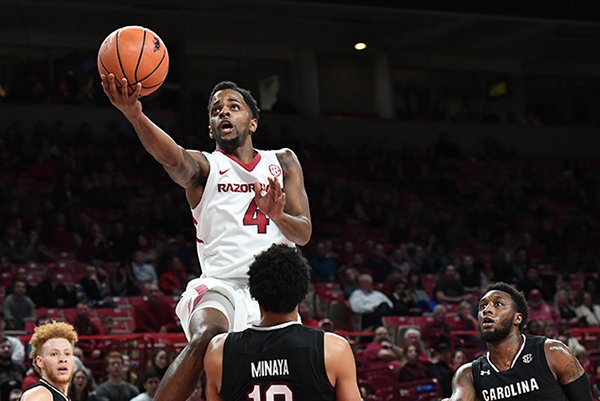 Arkansas' Daryl Macon (4) shoots a layup during a game against South Carolina on Tuesday, Feb. 6, 2018, in Fayetteville.