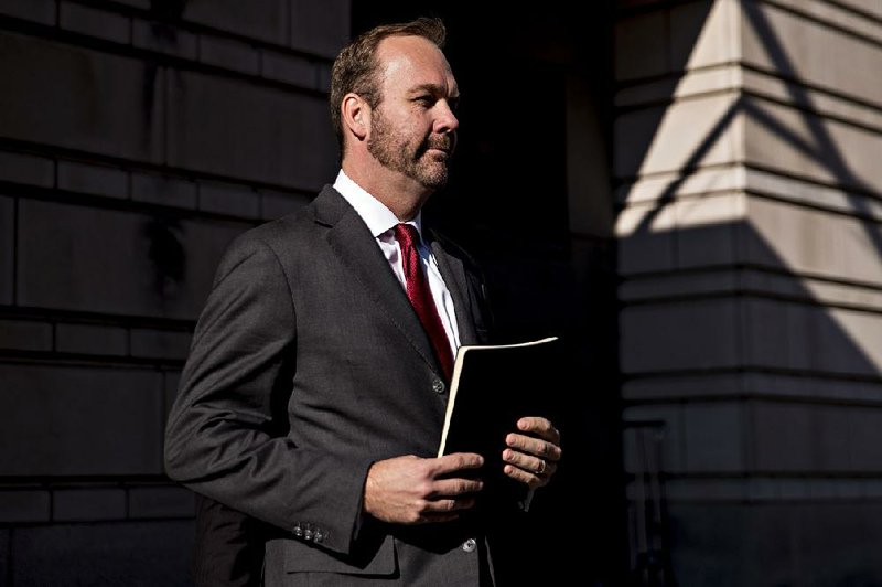 In this file photo Rick Gates, former deputy campaign manager for Donald Trump, walks to his vehicle after a status conference at the U.S. Courthouse in Washington on Dec. 11, 2017. 