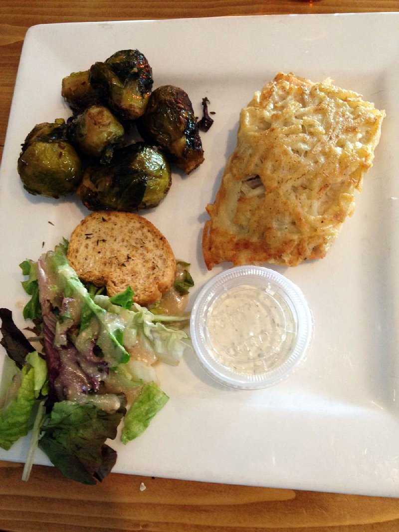 Potato Crusted Salmon with tartar sauce and chef’s choice Brussels sprouts with a small side salad is served at Cafe 1217 in Hot Springs.