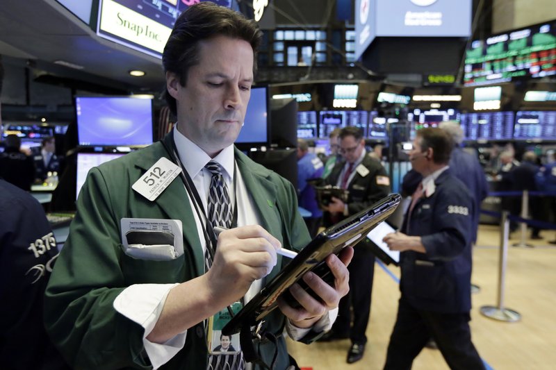 Trader Patrick McKeon works on the floor of the New York Stock Exchange, Wednesday, Feb. 7, 2018. (AP Photo/Richard Drew)