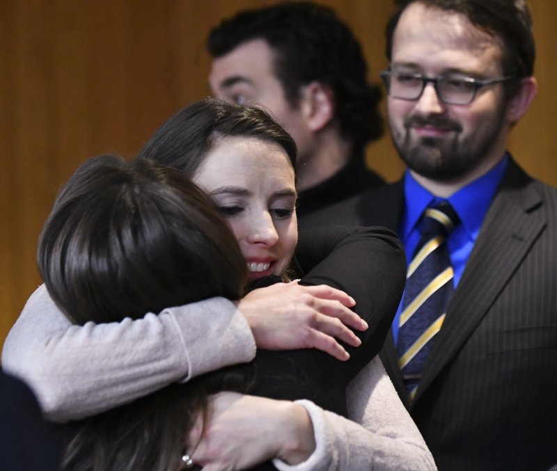 Rachael Denhollander hugs Det. Lt. Andrea Munford Monday, Feb. 5, 2018, after the third and final day of sentencing in Eaton County Court in Charlotte, Mich., where Nassar was sentenced on three counts of sexual assault. 