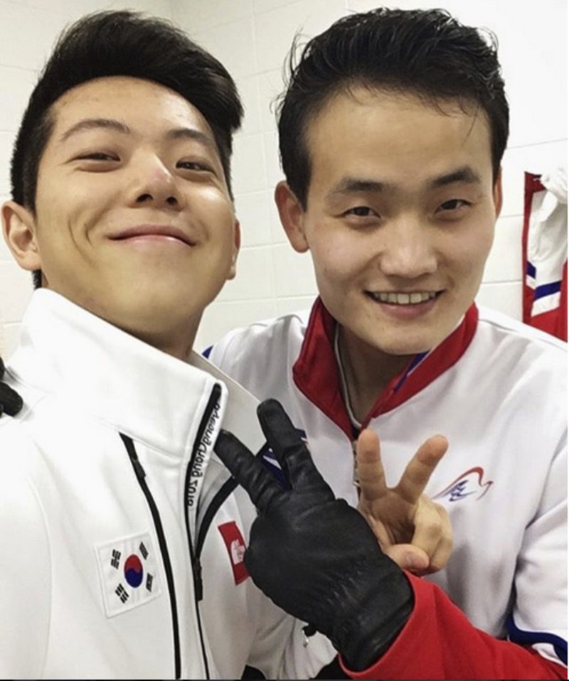 This February 2018 selfie provided by South Korean figure skater Alex Kam and posted on Instagram, shows him, left, posing with North Korean skater Kim Ju Sik in Gangneung, South Korea, ahead of the 2018 Winter Olympics. 