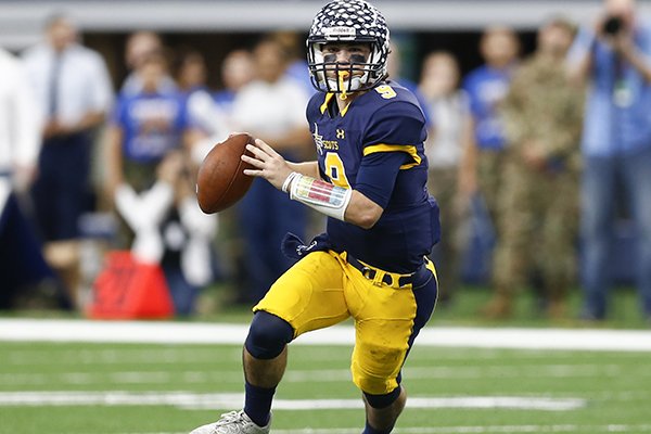 Highland Park quarterback John Stephen Jones (9) looks to pass against Temple during the first half of UIL Class 5A Division I state championship football game, Saturday, Dec. 17, 2016, in Arlington, Texas. (AP Photo/Jim Cowsert)

