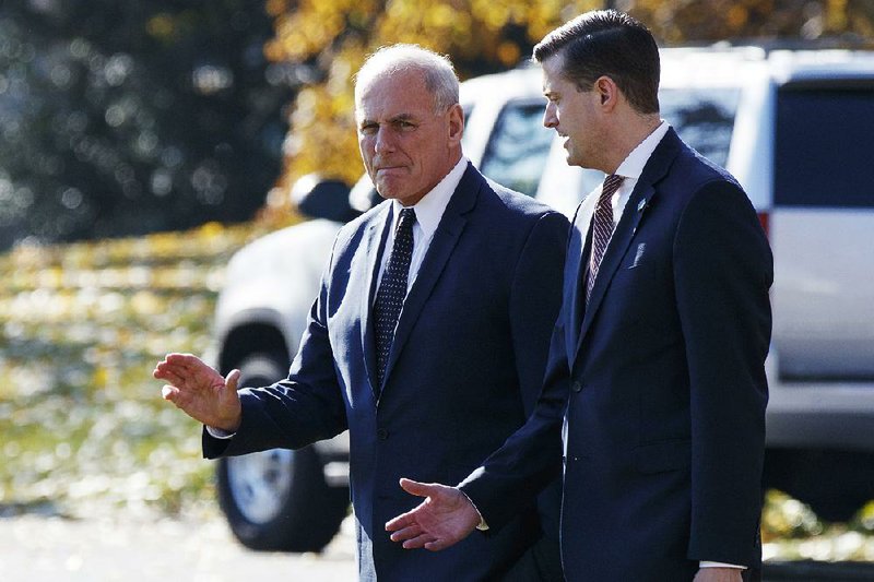 White House Chief of Staff John Kelly (left) walks with staff secretary Rob Porter to board Marine One on the South Lawn of the White House in November. 

