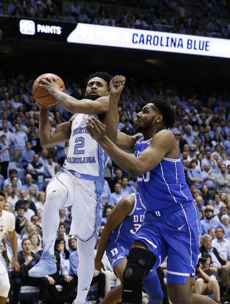 North Carolina’s Joel Berry II (left) scored 21 points in the No. 21 Tar Heels’ 82-78 victory over No. 9 Duke on Thursday night in Chapel Hill, N.C. 