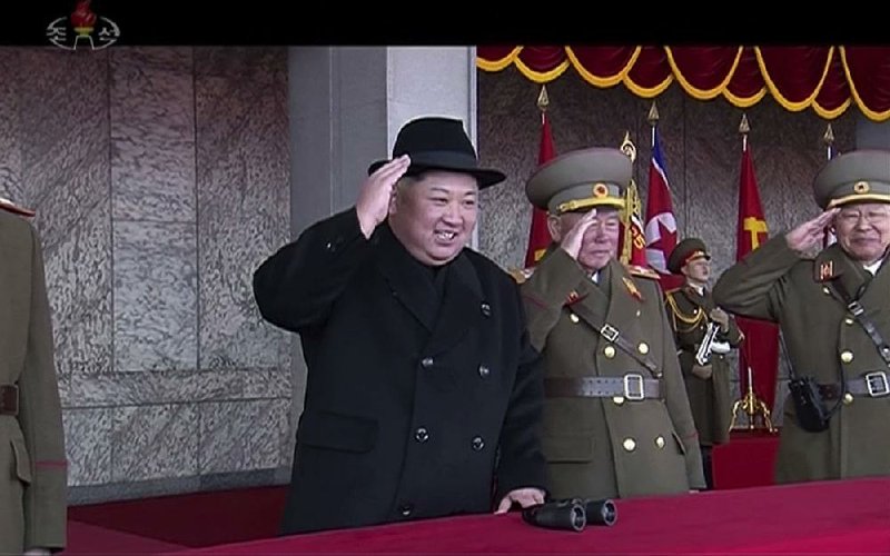 North Korean leader Kim Jong Un, shown in video from North Korea’s KRT, attends a military parade Thursday, one day before South Korea hosts the opening ceremony for the Winter Olympics. 