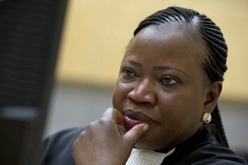 FILE - In this Nov. 27, 2013, file photo, prosecutor Fatou Bensouda waits for the start of the trial at the International Criminal Court (ICC) in The Hague, Netherlands. Prosecutor of the International Criminal Court Fatou Bensouda says she is opening preliminary probes into alleged crimes by police and security forces in the Philippines and Venezuela. Prosecutor Fatou Bensouda said in a statement Thursday Feb. 8, 2018. that the Philippines probe will focus on allegations since July 2016 that thousands of people have been killed in the government's war on drugs. (AP Photo/Peter Dejong, File)