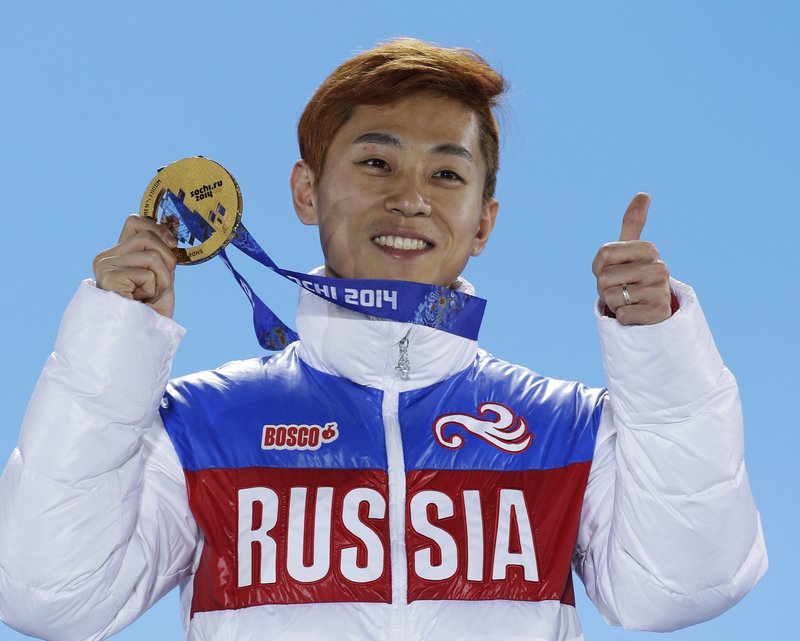 In this Feb. 15, 2014, file photo, men's 1,000-meter short track speedskating gold medalist Viktor Ahn, of Russia, gestures while holding his medal during the medals ceremony at the Winter Olympics in Sochi, Russia. Sports’ highest court rejected appeals by all 45 Russian athletes plus two coaches who were banned from the Pyeongchang Olympics over doping concerns in a decision announced Friday, Feb. 9, 2018, less than nine hours before the opening ceremony. Among those excluded are six-time gold medalist Ahn, the short track speedskater whose return to his native South Korea for the Olympics had been hotly anticipated by local fans. 