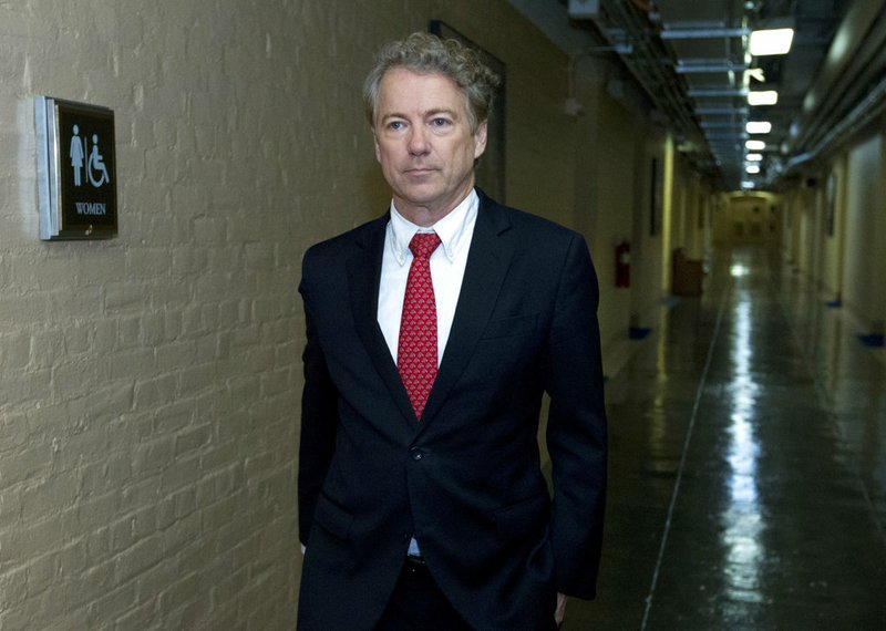 Sen. Rand Paul, R-Ky., walks to his office after speaking in the senate floor, at the Capitol, Thursday, Feb. 8, 2018, in Washington. 