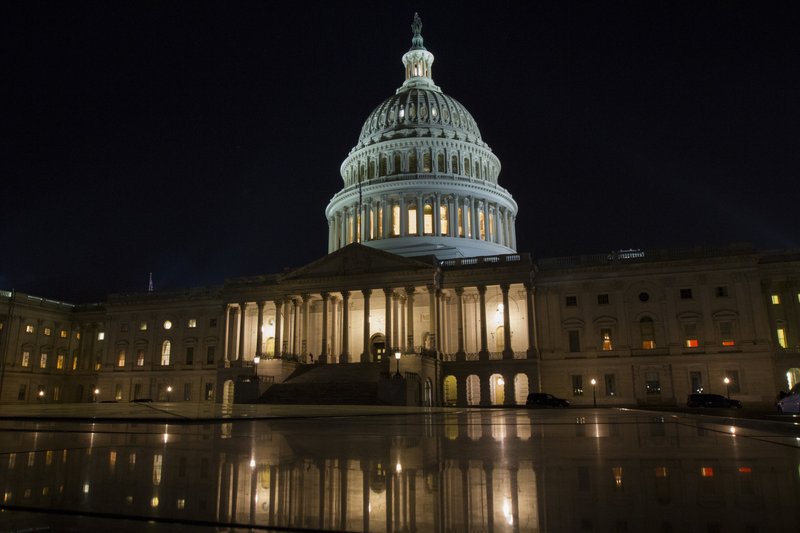 The U.S. Capitol in Washington on Thursday night, Feb. 8, 2018. The Senate passed a budget deal and spending measure to reopen the shuttered federal government early Friday morning, sending the bill to the House. (AP Photo/Jon Elswick)

