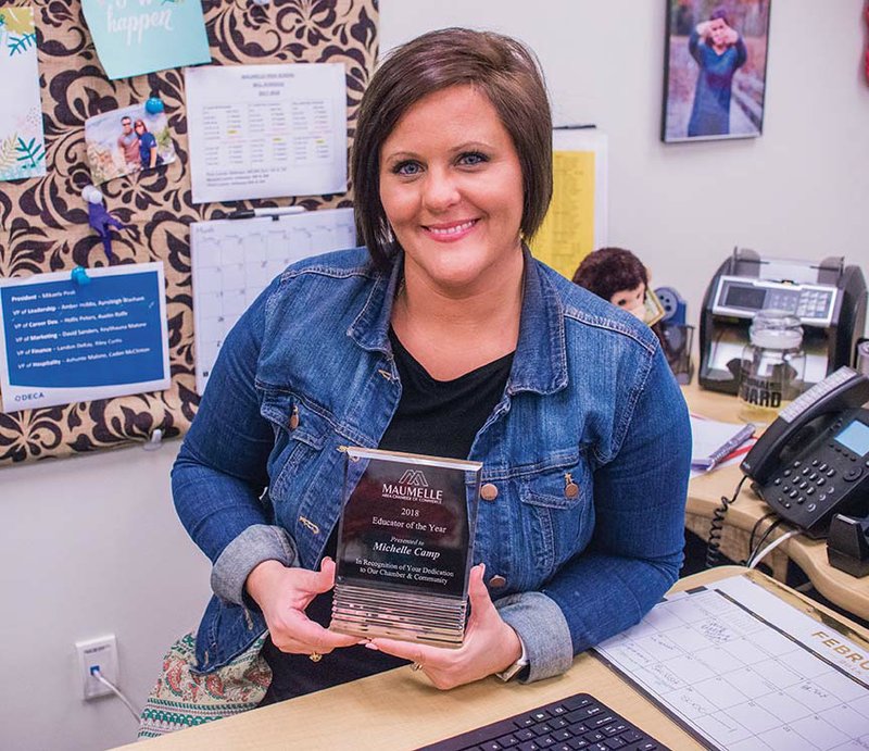 Michelle Camp, who teaches business and marketing at Maumelle High School, holds the award for 2018 Educator of the Year. She was honored in January by the Maumelle Area 
Chamber of Commerce. Camp is sponsor of the high school’s chapter of DECA, an association of marketing students, and oversees the work program in the community. She’s also a member of the chamber’s educational committee.