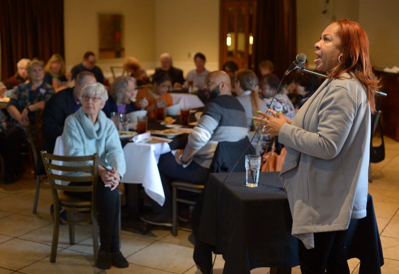 Kamra Elizabeth Mays (right), a clinical psychologist, speaks Thursday about mental health issues faced by members of the black community during a forum as part of Black History Month events organized by Compassion Fayetteville in partnership with Northwest Arkansas NAACP.